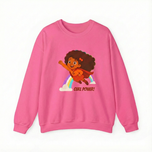 Pink kids’ crewneck sweatshirt featuring the “Curl Power” graphic of a curly-haired superhero girl with rainbow accents.