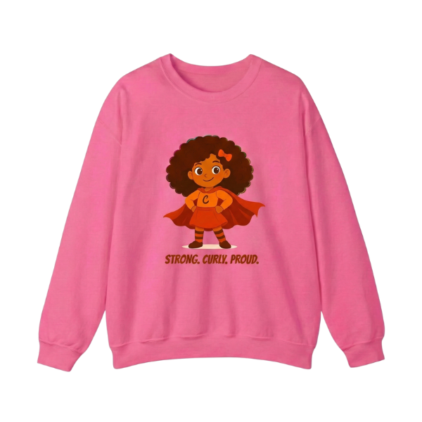 Pink kids’ crewneck sweatshirt with “Strong. Curly. Proud.” superhero curly-hair graphic — bold and empowering design for curly-haired girls.