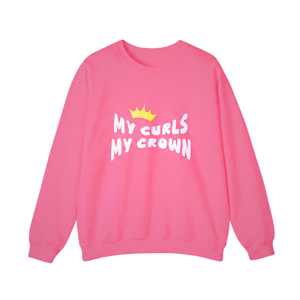 Pink kids’ crewneck sweatshirt featuring the “My Curls My Crown” graphic with a yellow crown, empowering curly-haired girls. Curlability apparel mockup.